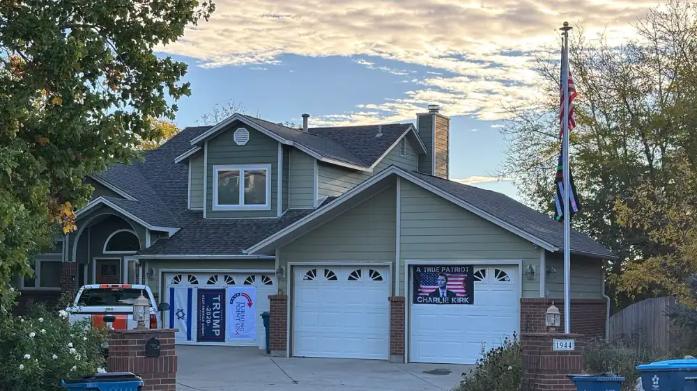 A well-maintained home exterior and roof edge viewed from the street before a sale