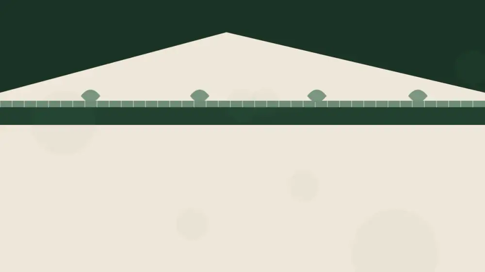 A guarded gutter beside an open gutter filled with leaves