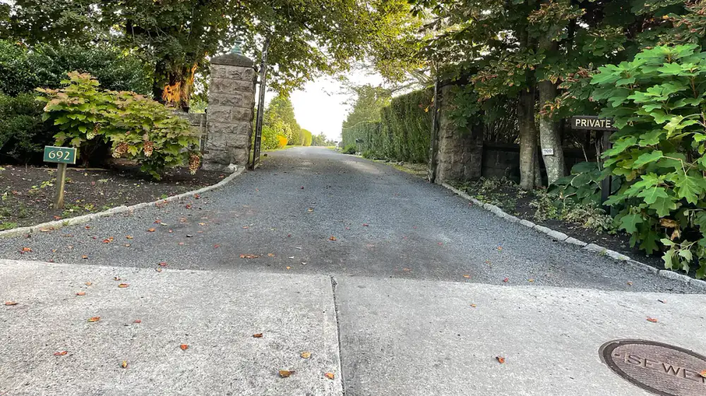 Clean residential driveway leading to a home