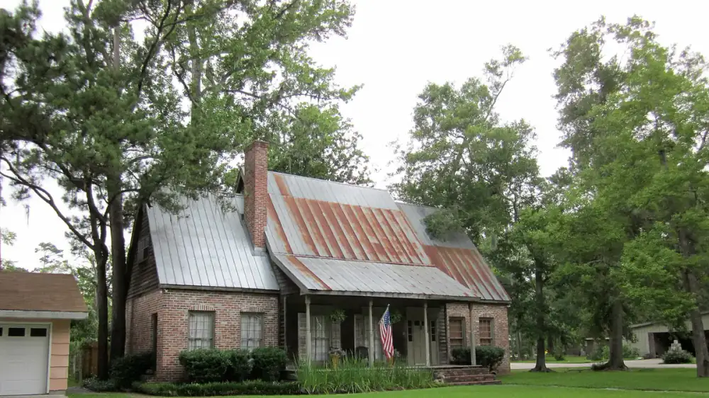 Metal roof panels being cleaned with a gentle low-pressure method