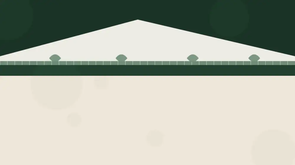 Leaves and debris resting on top of a gutter guard along a roof edge