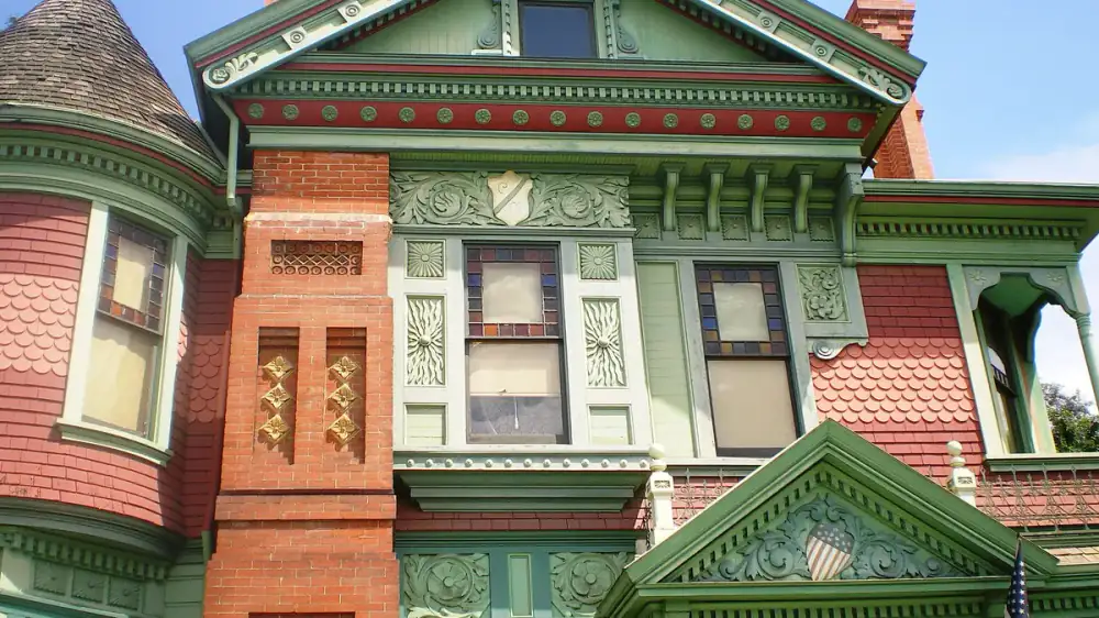 A repair section of new material blending into the weathered facade of an older home