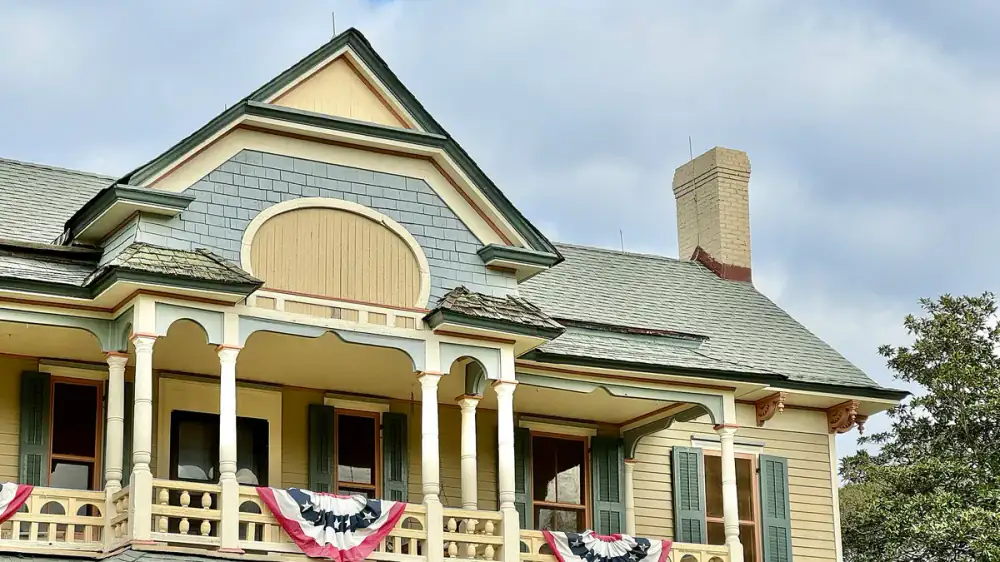 White painted wood clapboard siding with visible brush texture