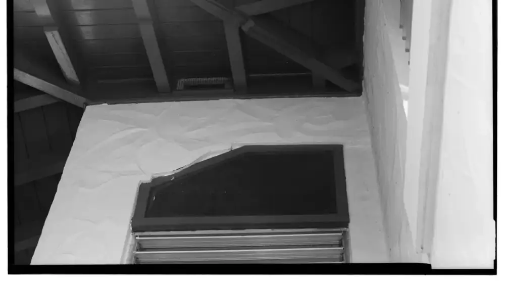 Diagram-style view of air flowing from soffit vents up through a ridge vent