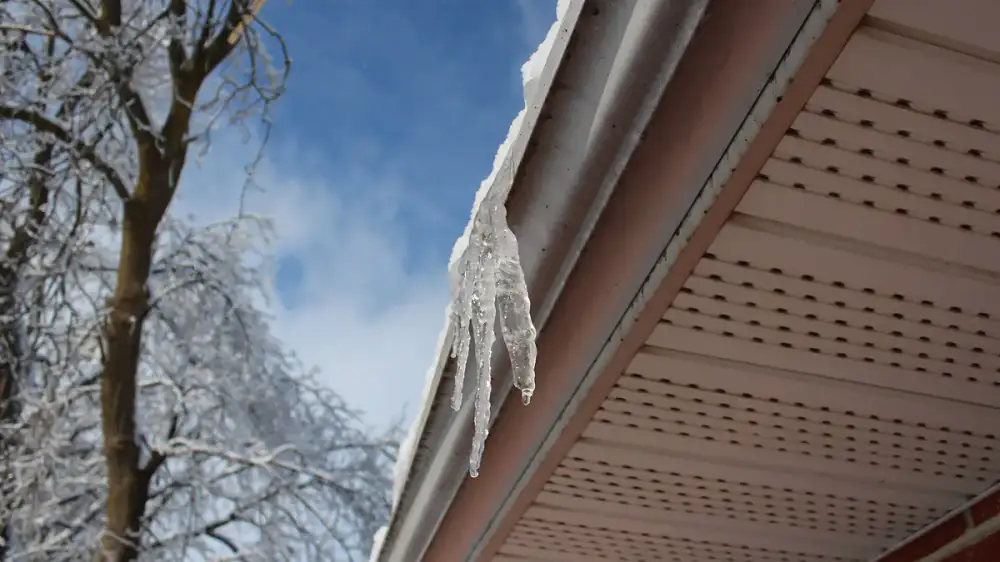 A section of gutter sagging and pulling away from the fascia