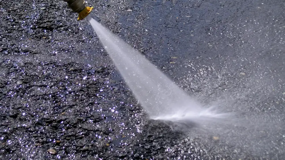 Set of color-coded pressure washer nozzle tips arranged by spray angle