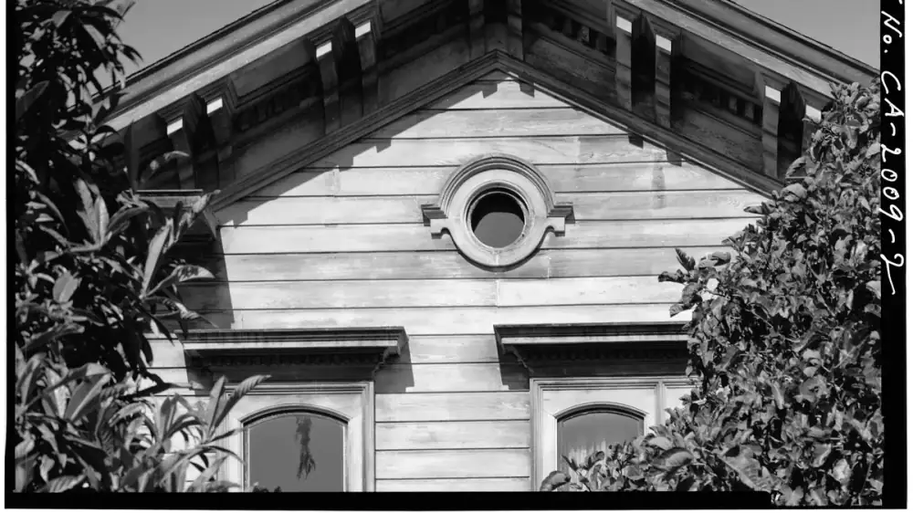Horizontal frieze board trim installed where the exterior wall meets the soffit under a roof overhang