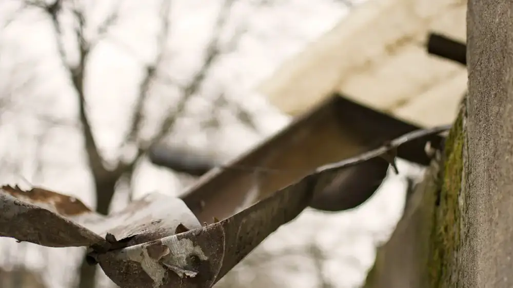 A section of home gutter sagging away from the roofline