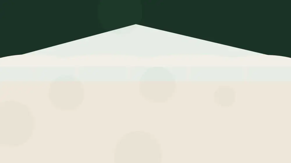 A roof edge with icicles and packed snow along the eave in a cold winter climate